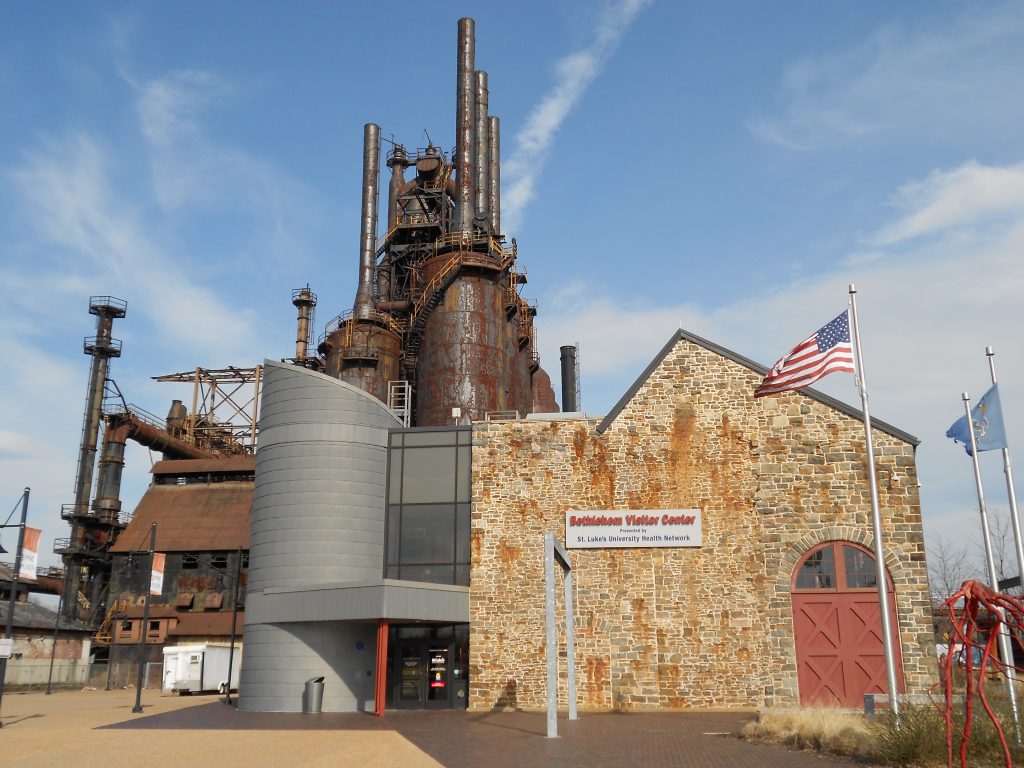 Bethlehem Visitor Center entrance in the foreground with the old Bethlehem Steel blast furnaces in the background